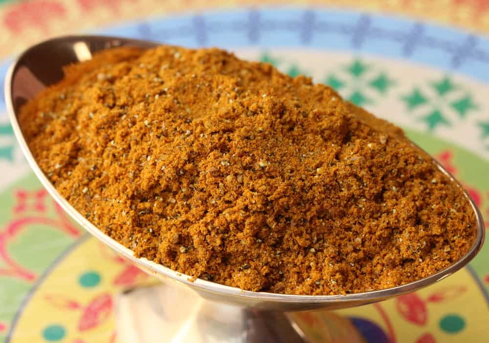 Homemade curry powder in a small golden vessel. 
