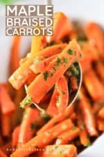 A spoon holding up a mound of maple braised carrots.