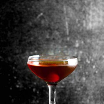 A glass filled with a Classic Manhattan Cocktail