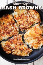 An overhead view of a large non-stick skillet filled with diner-style crispy hash browns.