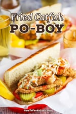 A straight-on view of two baskets filled with a fried catfish po-boy sitting next to a tall glass of beer.