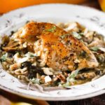 A single serving in an antique plate of chicken and sage casserole.