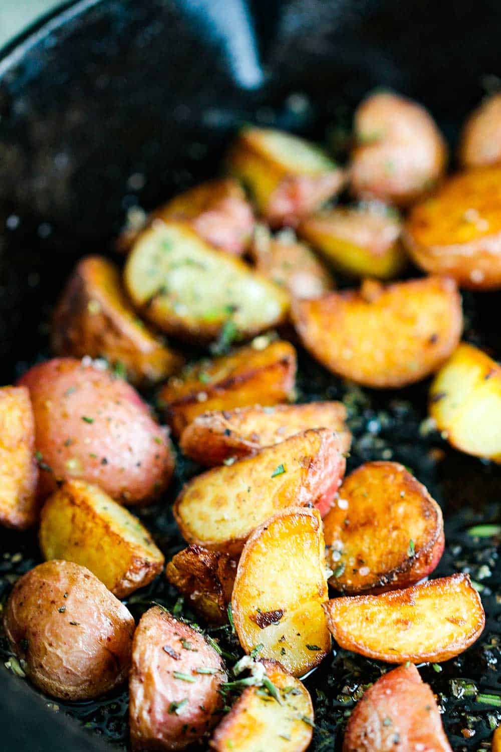 Crispy baby new potatoes in a cast iron skillet