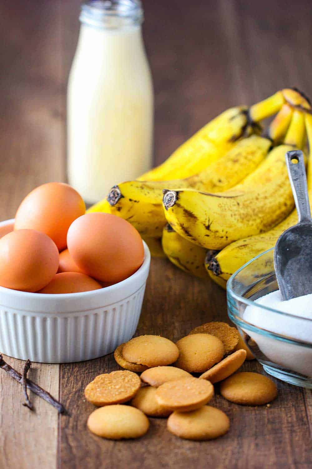 Eggs, bananas, sugar and cream for banana pudding. 