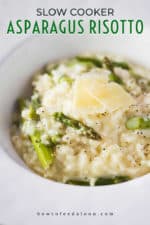 A close-up view a large white bowl filled with slow cooker asparagus risotto.
