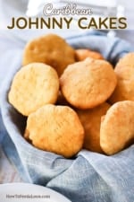 A basket lined with a grey napkin and filled with fried Caribbean Johnny Cakes.