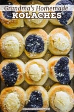 An overhead view of a baking pan filled with freshly baked kolaches topped with poppyseed filling and cream cheese filling.