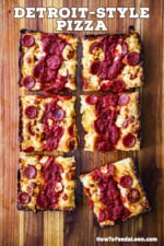 An overhead view of a deep-dish pepperoni pizza that has been cut into six squares.