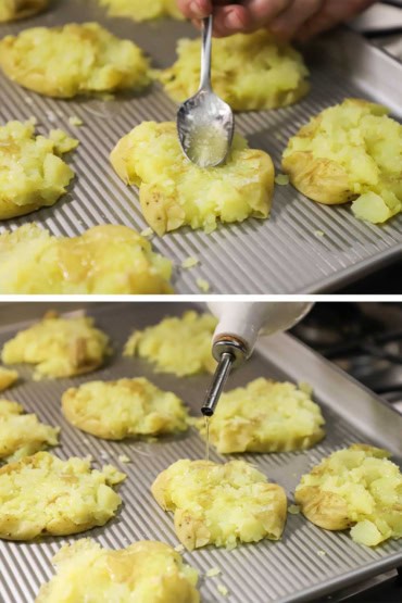 A person using a small spoon to drizzle melted butter over smashed potatoes on a baking sheet and then another view of olive oil being drizzled over the melted butter.