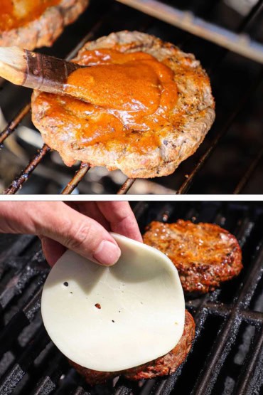 Two images with the first being a person slathering on steak sauce on to a burger on a smoker grate and then a person placing a circular piece of provolone cheese onto the same burger.