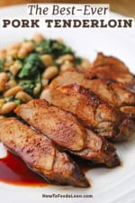 A close-up view of sliced pork tenderloin with a cranberry reduction sauce drizzled on top with a serving of sautéed white beans and spinach next to it.