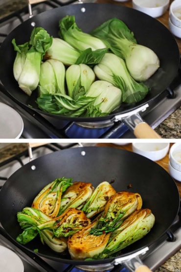 Two photos with the first a view of a wok on a gas stove with four baby bok choy cabbages that have been halved, lengthwise, and are being sautéed and then the next is them flipped over and darkened from the sauce.