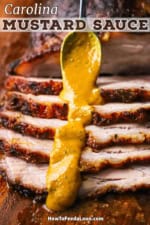 A person using a spoon to pour a line of Carolina mustard sauce over sliced pork brisket.