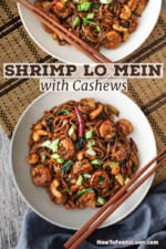 Two white bowls sitting next to each other both filled with shrimp lo mein with cashews with chopsticks sitting on each bowl.
