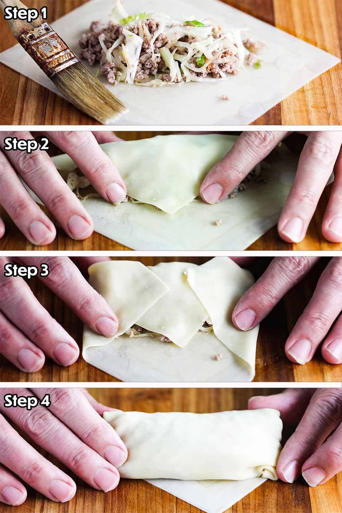 A person rolling an egg roll wrapper over a pork and cabbage filling. 