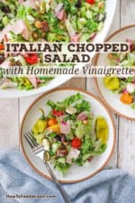 Two salad plates filled with individual servings of Italian chopped salad with homemade vinaigrette next to a large platter filled with the same salad.