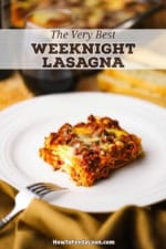 A square slice of Best Weeknight Lasagna resting on a white dinner plate with a fork nearby.