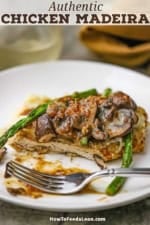 A half eaten serving of chicken Madeira on a white dinner plate.