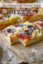A close-up view of a square slice of sheet pan pepperoni pizza with a bite missing from it.