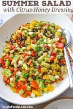 A large platter filled with a tossed Southwestern Summer Salad.