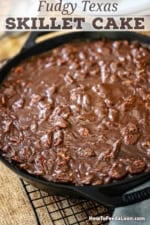 A close-up view of a Fudgy Texas Skillet Cake in a large cast-iron skillet.